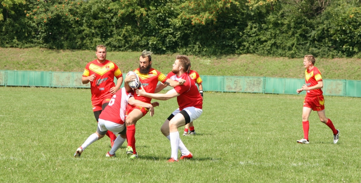 Skane Stags player breaking through a tackle in Poland.